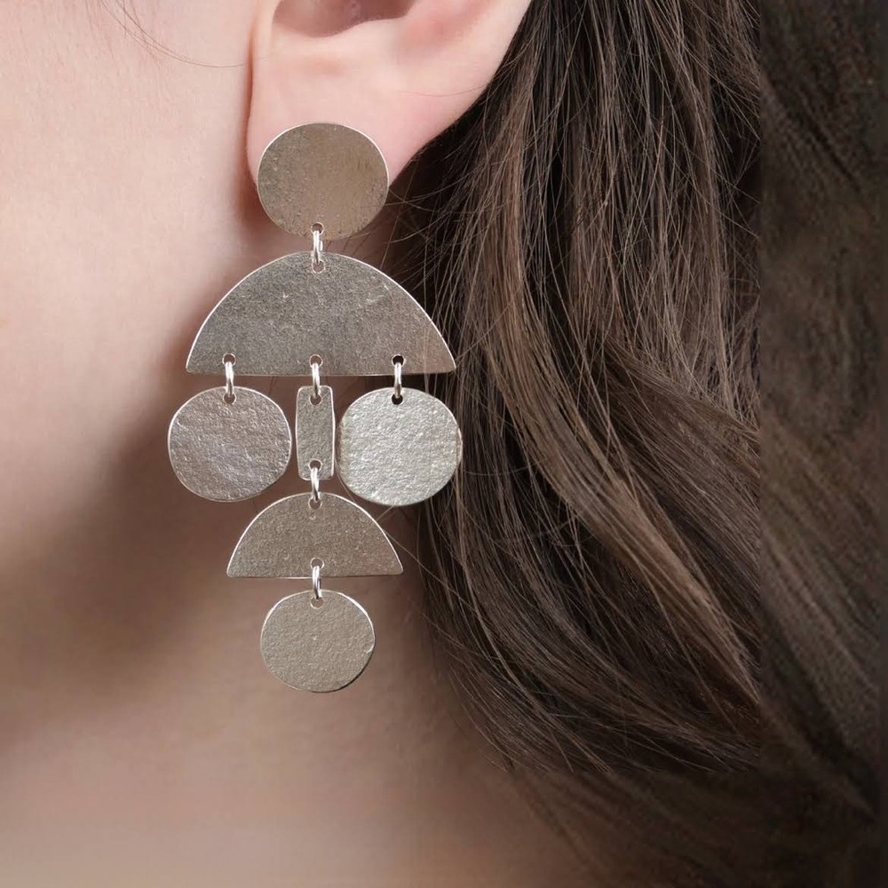 Annie Costello Brown pom pom earrings in silver